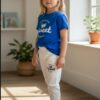 WhatsApp Image 2026-10-03 at 1.14.18 PM (1) Sweet Strawberry Graphic T-Shirt & Leggings Set – Royal Blue Tee with Cream Leggings, Casual 2-Piece Outfit